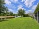 Lush backyard with waterfront views and ample space for outdoor activities and relaxation at 16711 Rivers Reach Blvd, Parrish, FL 34219