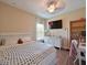 Bedroom with wood floors and a large window, offering a bright and inviting atmosphere for sleep or study at 16711 Rivers Reach Blvd, Parrish, FL 34219