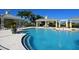 Inviting community pool featuring comfortable lounge seating and well-maintained landscaping, perfect for a relaxing day at 16711 Rivers Reach Blvd, Parrish, FL 34219