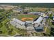 Aerial view of a baseball stadium with manicured fields and spectator seating in a vibrant community at 16849 Castoro Dr, Port Charlotte, FL 33953
