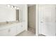 Modern bathroom with double sinks, white cabinets, and tiled walk-in shower at 16849 Castoro Dr, Port Charlotte, FL 33953