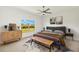 Comfortable bedroom with a large window overlooking the beautiful backyard at 16849 Castoro Dr, Port Charlotte, FL 33953