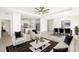 Bright, open-concept living room flows into the kitchen and dining area, perfect for entertaining at 16849 Castoro Dr, Port Charlotte, FL 33953