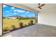Covered patio with brick pavers, ceiling fan, and view of the manicured lawn and landscaping at 16849 Castoro Dr, Port Charlotte, FL 33953