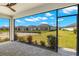 Screened-in patio offers great backyard views and outdoor living at 16849 Castoro Dr, Port Charlotte, FL 33953