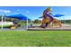 Colorful playground with slides, climbing structures, and shaded areas for fun outdoor activities at 16849 Castoro Dr, Port Charlotte, FL 33953