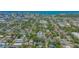An aerial view showcases the property nestled in a leafy neighborhood with city and waterfront backdrop at 1742 9Th St, Sarasota, FL 34236