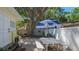 Backyard with seating, a grill, and a large tree at 1742 9Th St, Sarasota, FL 34236