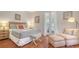 Bright bedroom featuring bed, bench, and lounge chair at 1742 9Th St, Sarasota, FL 34236