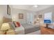 Bedroom with a bed, french doors, and a seating area at 1742 9Th St, Sarasota, FL 34236
