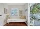 Cozy bedroom with a daybed, side table, and view to the exterior at 1742 9Th St, Sarasota, FL 34236