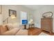Cozy bedroom featuring sitting area with wicker furniture and a television at 1742 9Th St, Sarasota, FL 34236