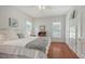 Bright bedroom with white walls, wood floors, and a comfortable king-size bed at 1742 9Th St, Sarasota, FL 34236