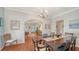 Spacious dining room with hardwood floors and an open archway leading to the living room at 1742 9Th St, Sarasota, FL 34236