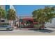 Exterior of Artisan Cheese Company featuring modern architectural design and vibrant red accents at 1742 9Th St, Sarasota, FL 34236