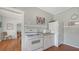 A kitchen with a white refrigerator and range with view into another room at 1742 9Th St, Sarasota, FL 34236