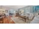 Bright living room featuring hardwood floors, soft blue walls, and comfortable furniture at 1742 9Th St, Sarasota, FL 34236