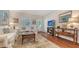 Bright living room with hardwood floors and comfortable seating, creating a cozy space to relax and enjoy at 1742 9Th St, Sarasota, FL 34236