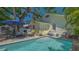 Inviting pool and patio area perfect for outdoor lounging and entertaining near mature shade trees at 1742 9Th St, Sarasota, FL 34236