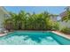 Relax by the pool surrounded by lush landscaping in this private backyard retreat at 1742 9Th St, Sarasota, FL 34236