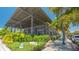 Cozy restaurant features a metal roof, brick walls and established bushes at 1742 9Th St, Sarasota, FL 34236