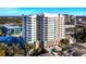 Luxury high-rise condo featuring an outdoor pool, multiple balconies, and contemporary architectural details at 1771 Ringling Blvd # 1104, Sarasota, FL 34236