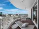 Relaxing balcony with lounge chairs and city views at 1771 Ringling Blvd # 1104, Sarasota, FL 34236