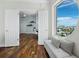 Cozy bedroom nook featuring bench seating, hardwood floors, and natural light at 1771 Ringling Blvd # 1104, Sarasota, FL 34236