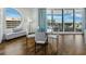 Elegant dining area with a glass table, stylish chairs, and ample natural light at 1771 Ringling Blvd # 1104, Sarasota, FL 34236