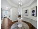 Elegant condo foyer featuring hardwood floors, stylish lighting, and modern artwork on the walls at 1771 Ringling Blvd # 1104, Sarasota, FL 34236