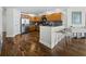 Bright kitchen with wood cabinets, stainless steel appliances and breakfast bar at 1771 Ringling Blvd # 1104, Sarasota, FL 34236