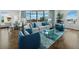 Spacious living room featuring hardwood floors, stylish decor, and large windows with city views at 1771 Ringling Blvd # 1104, Sarasota, FL 34236