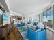 Open-concept living area with hardwood floors, comfortable seating, and access to the kitchen at 1771 Ringling Blvd # 1104, Sarasota, FL 34236