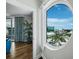 Living room view to a balcony with floor to ceiling windows and a beautiful city view at 1771 Ringling Blvd # 1104, Sarasota, FL 34236
