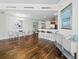 Open-concept living space with hardwood floors and elegant decor at 1771 Ringling Blvd # 1104, Sarasota, FL 34236