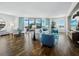 Bright and airy living room with hardwood floors, stylish furnishings, and city views at 1771 Ringling Blvd # 1104, Sarasota, FL 34236