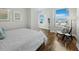Bright bedroom featuring stylish chair and unique circular windows for ample natural light at 1771 Ringling Blvd # 1104, Sarasota, FL 34236