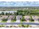 Expansive aerial shot showcases the neighborhood's layout with homes, ponds, and green spaces at 18045 Polo Trail St, Bradenton, FL 34211