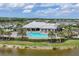 Aerial view of the resort-style amenities including clubhouse, pool, and lush landscaping in a beautiful community setting at 18045 Polo Trail St, Bradenton, FL 34211