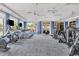 Spacious fitness center with a variety of cardio and weight training equipment, designed for a comprehensive workout at 18045 Polo Trail St, Bradenton, FL 34211