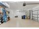 Spacious two car garage with epoxy floors, overhead racks and plenty of room for parking and storage at 18045 Polo Trail St, Bradenton, FL 34211
