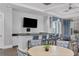 Stylish lounge area with bar seating, a television, and comfortable chairs perfect for socializing at 18045 Polo Trail St, Bradenton, FL 34211