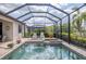 Relaxing pool with screened enclosure, lounge chairs, and lush greenery at 18045 Polo Trail St, Bradenton, FL 34211