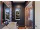 Stylish bathroom with unique wallpaper, and a glass shower at 19208 Ganton Ave, Lakewood Ranch, FL 34202