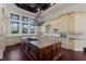 Gourmet kitchen with center island, custom cabinetry, and chef-grade appliances at 19208 Ganton Ave, Lakewood Ranch, FL 34202