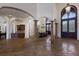 Open floor plan with columns, high ceilings, and decorative tile flooring showcasing the home's elegance at 19208 Ganton Ave, Lakewood Ranch, FL 34202