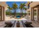 Relaxing pool area with palm trees, lounge chairs, and an integrated spa for ultimate leisure at 19208 Ganton Ave, Lakewood Ranch, FL 34202