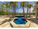 Custom pool featuring palm trees, water features, and a captivating design for outdoor enjoyment at 19208 Ganton Ave, Lakewood Ranch, FL 34202