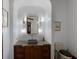 Stylish powder room with designer fixtures, marble countertop, and modern lighting offering a luxurious touch at 19208 Ganton Ave, Lakewood Ranch, FL 34202