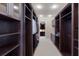 A large walk-in closet featuring extensive built-in storage and shelving at 19208 Ganton Ave, Lakewood Ranch, FL 34202